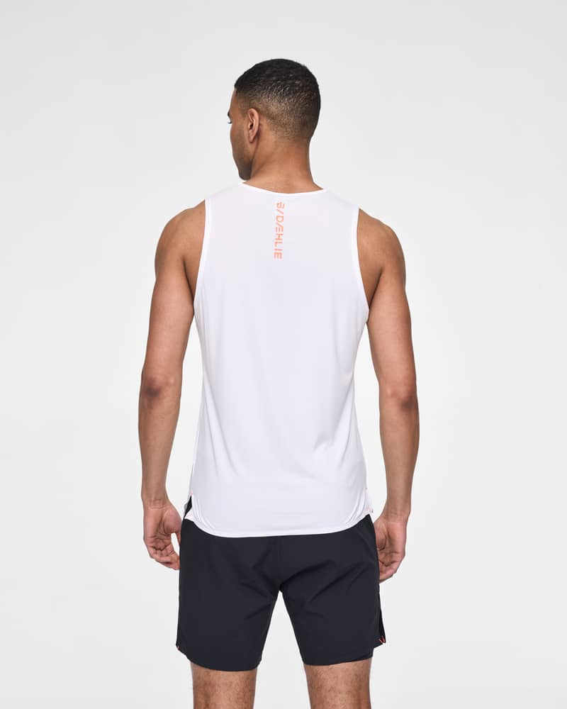 Back of a male runner in the white Dæhlie Singlet Run 365, highlighting the athletic fit for running.