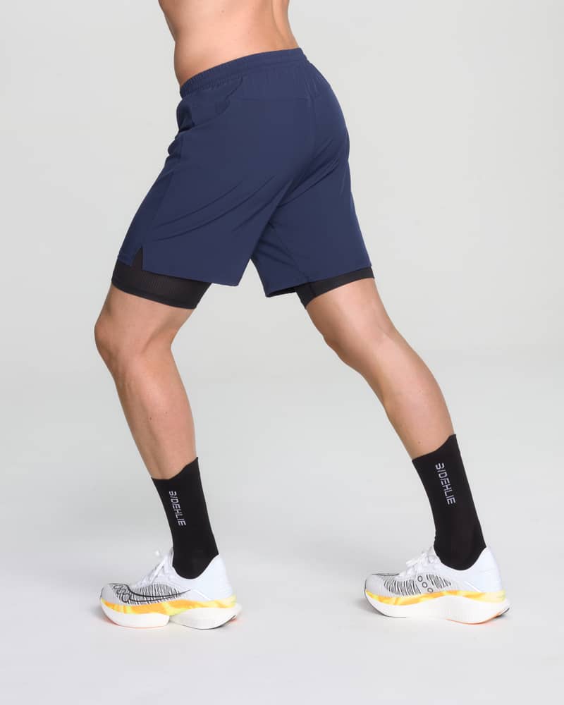 Back view of a runner in Dæhlie's navy running shorts, showing the active fit for medium-intensity runs.