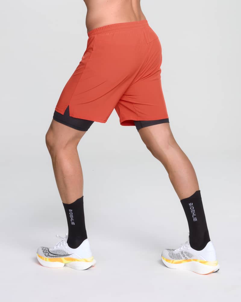 Back view of a runner in Dæhlie's red shorts, showing the comfortable fit for daily jogging.