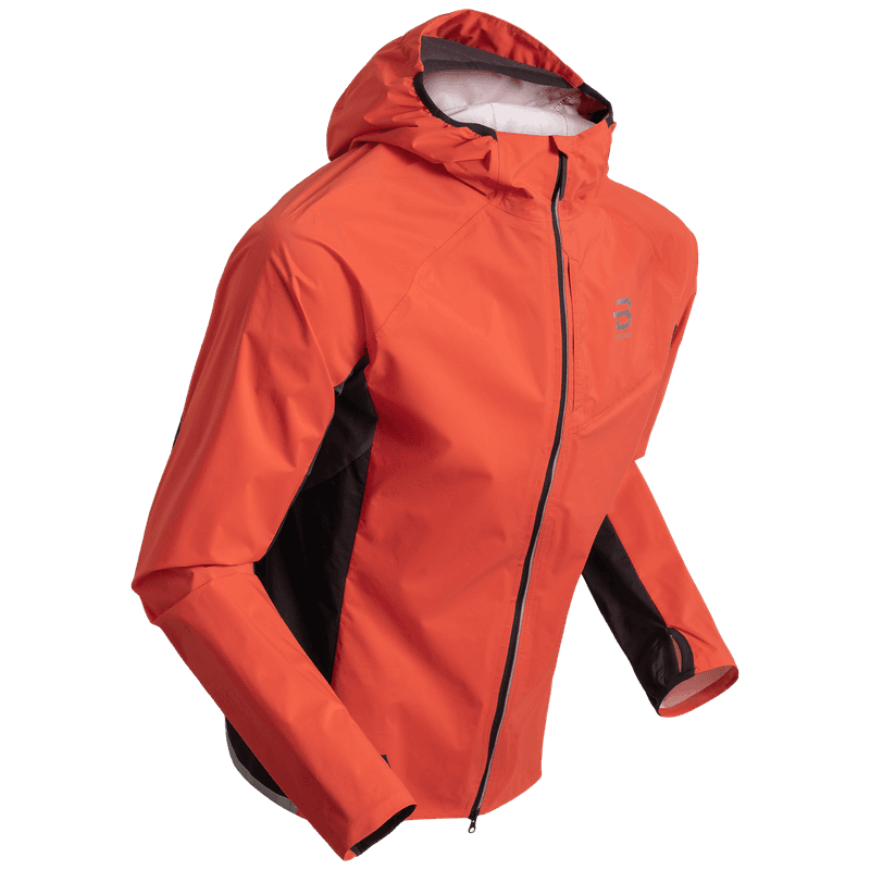 Men's Dæhlie Jacket Advance Light in spicy orange, a high-visibility, waterproof running jacket designed for challenging weather.