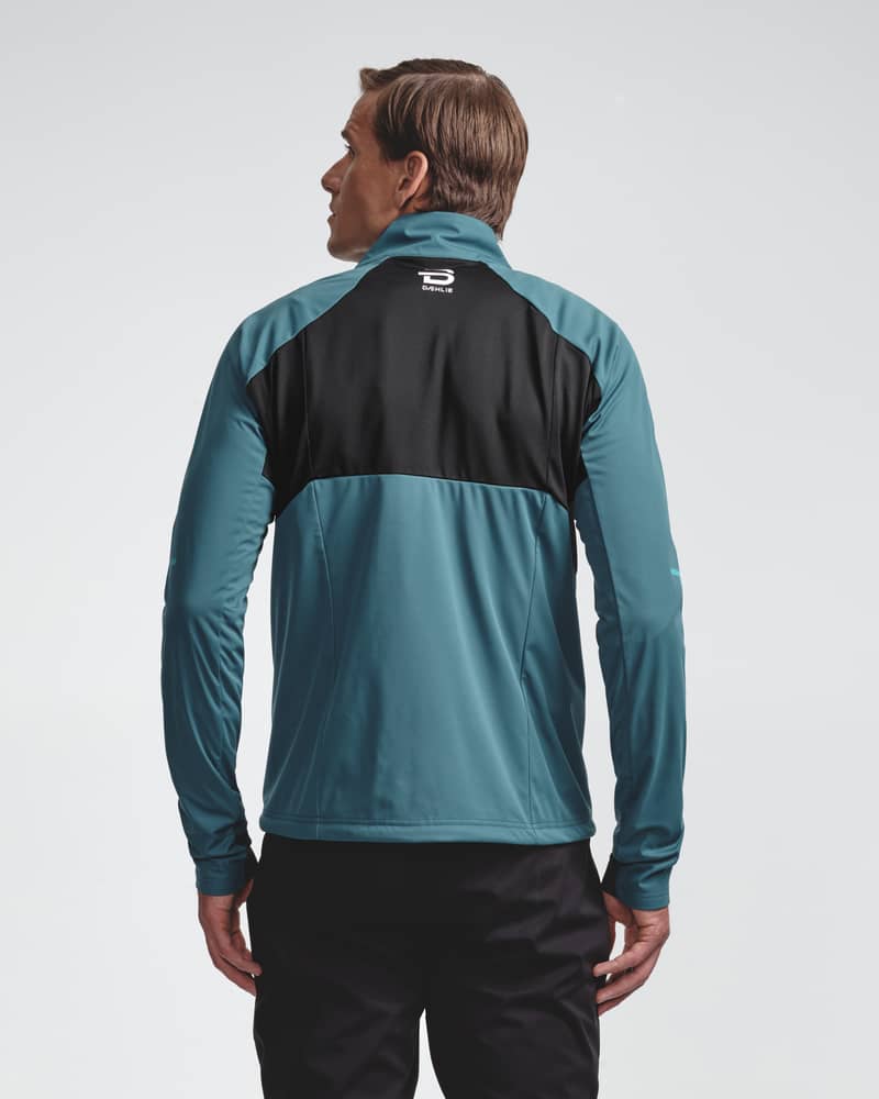 Teal men's Jacket Challenge 3.0, back view on model showing ventilation panels for cross-country skiing.