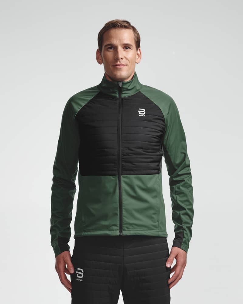 Dark green men's Jacket Challenge 3.0, front view on model for cold weather nordic skiing.