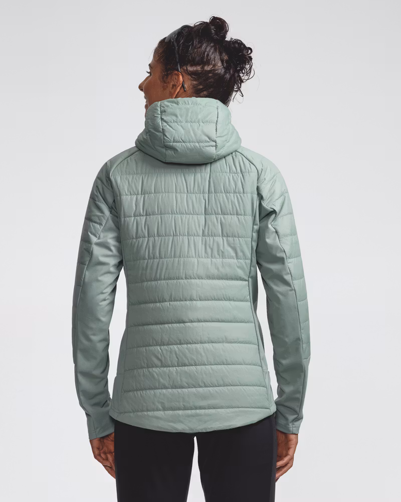Sage green quilted hooded jacket, back view on model
