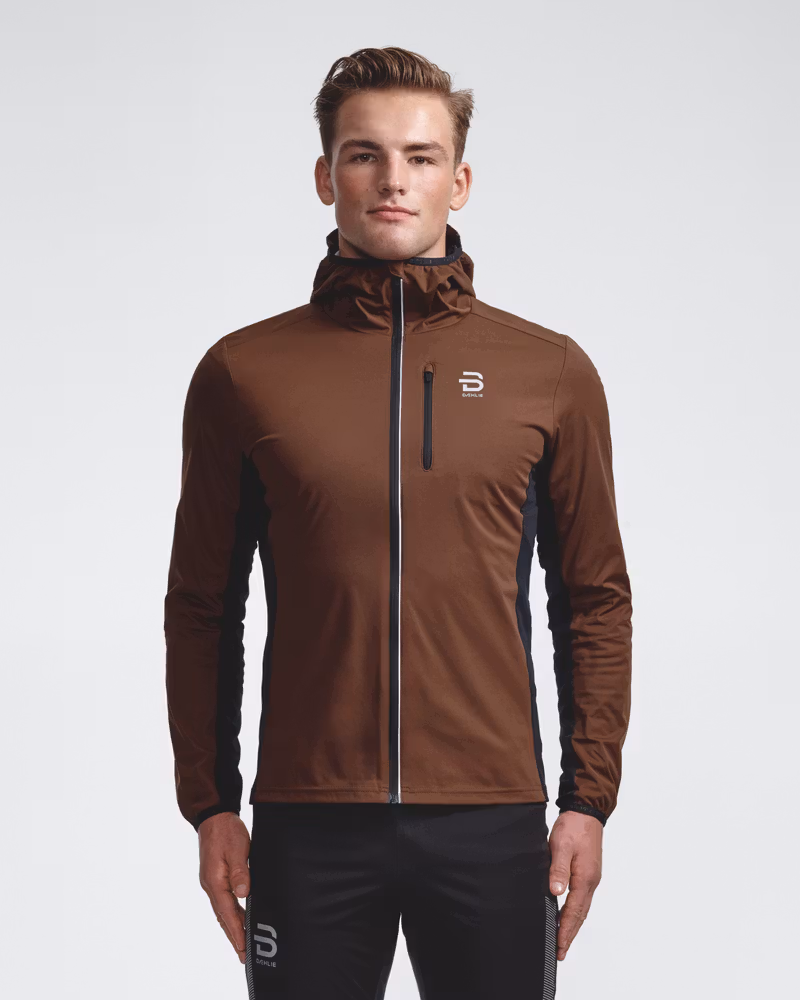 Male model wearing the brown and black Jacket Winter Run Protect men's, a hooded softshell jacket for winter running.