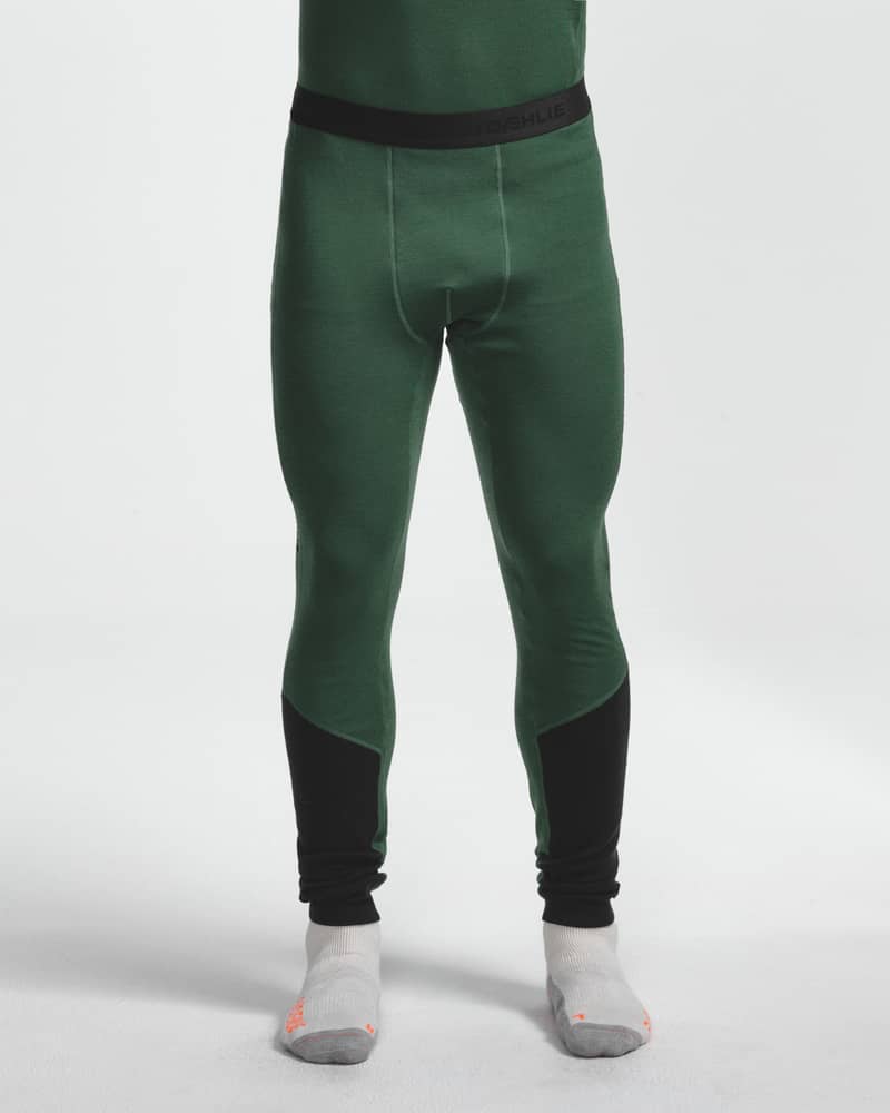 Dæhlie green baselayer leggings with black ankle panels on male model, front view